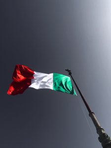 Italian Flag blowing in the wind representing pride and resolve